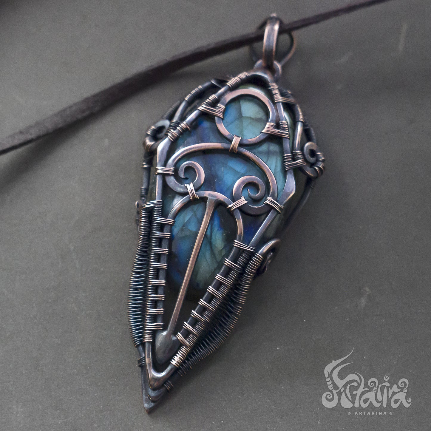 Wire wrapped jewelry for men. Intricate filigree hand weaved pendant with blue and green stone. Dark brown patina freeform necklace
