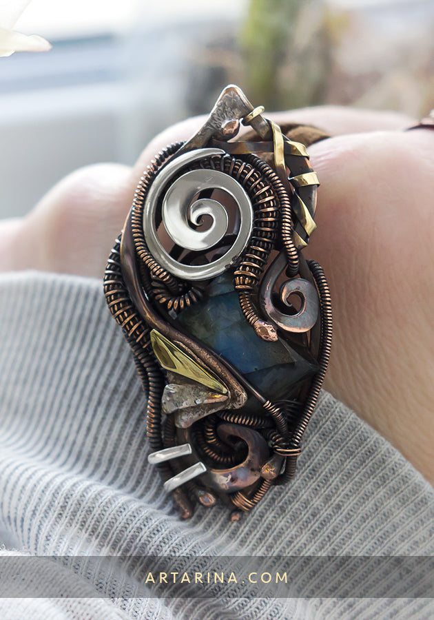 Copper, silver and brass pendant