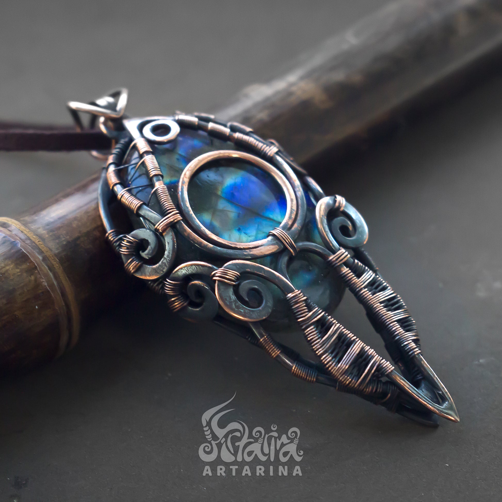 Men's wire wrapped pendant made from copper with multicolored blue spectrolite labradorite