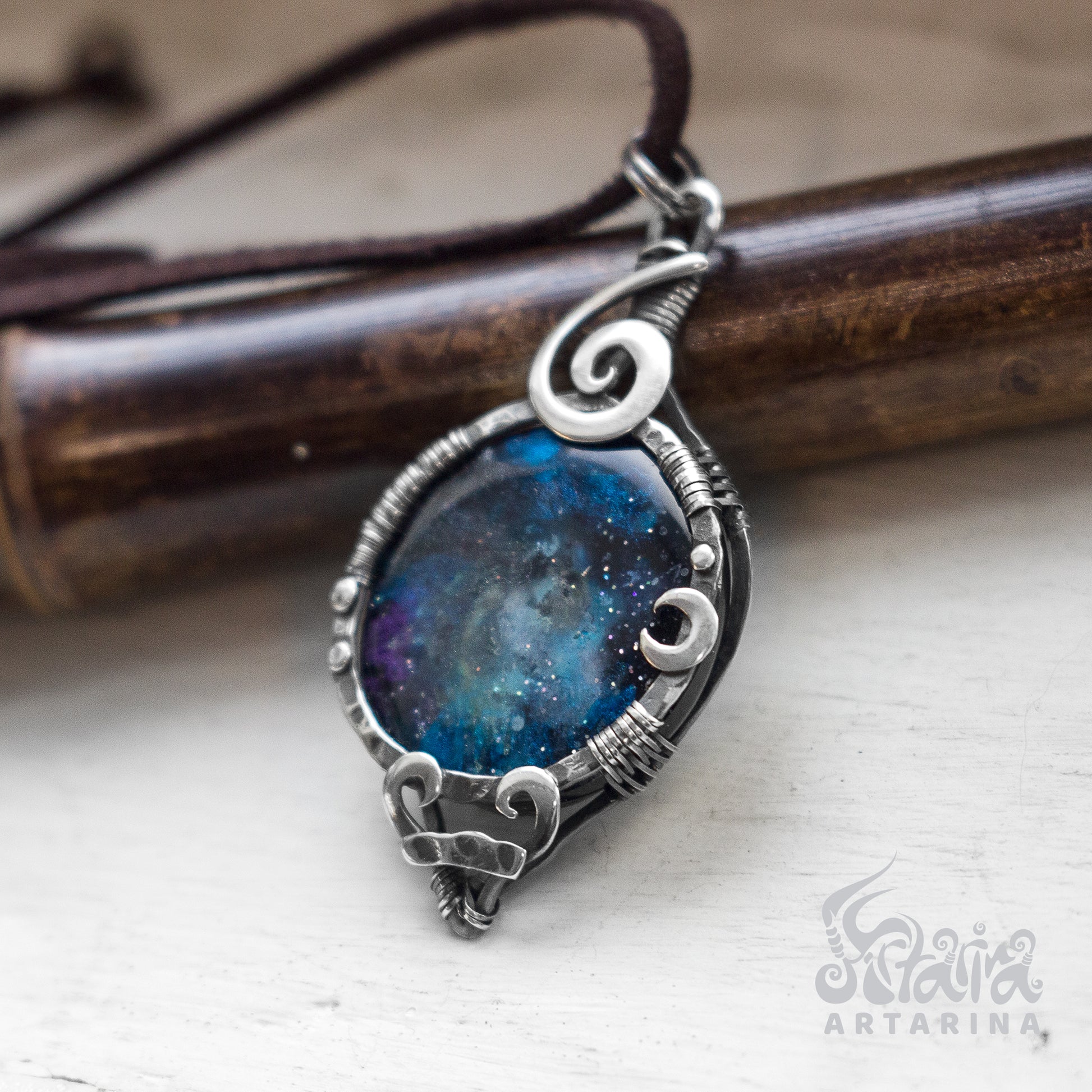Handmade silver pendant with a cosmic stellar nebula design and a hand-painted night sky epoxy resin cabochon. pic 4