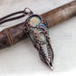Unique pendant crafted from antiqued copper wire, showcasing a shiny labradorite stone with natural and spiritual allure. pic