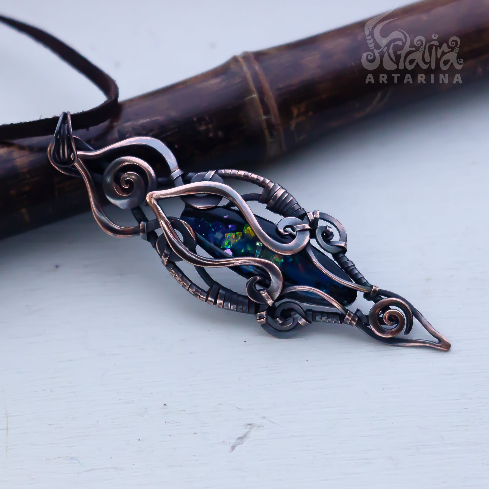 Decorative brooch with intricate design on a light background