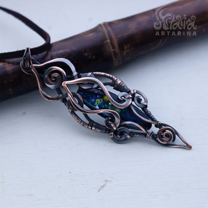 Decorative brooch with intricate design on a light background