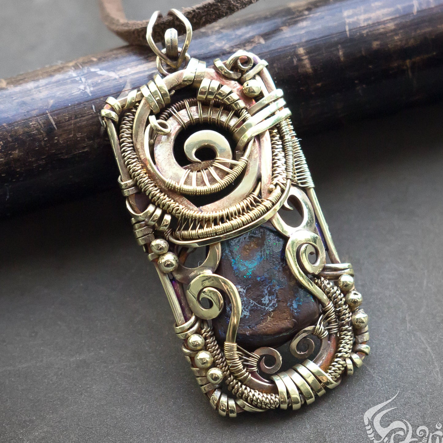 handcrafted golden colored brass wire wrapped necklace with boulder opal stone by Artarina