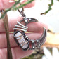Wire wrapped crescent moon necklace. Rose quartz gemstone pendant
