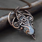 Copper wire wrapped pendant with carved moonstone. 