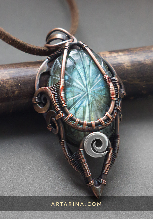 Brown gothic pendant with carved blue labradorite on neck
