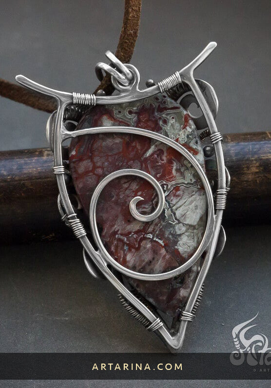 back side of sterling silver pendant with unique pattern crazy lace agate gemstone
