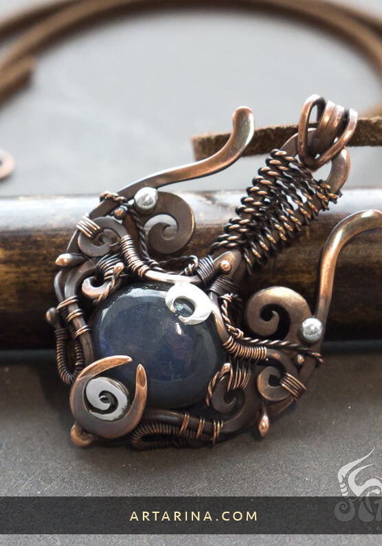 Mixed metal treasure artifact pendant with dark blue labradorite