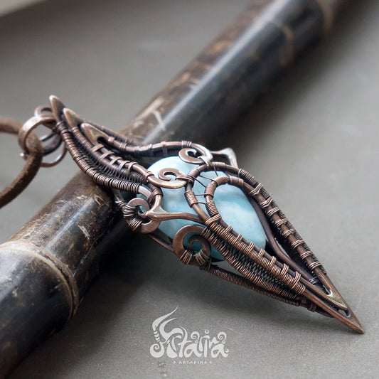 Larimar wire wrapped pendant. Wirework light blue gemstone necklace