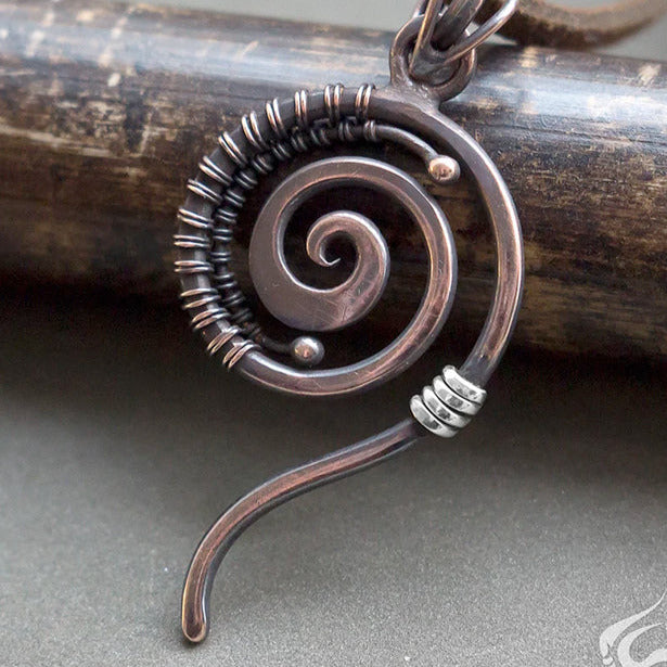 Small spiral shaped copper wire wrapped simple necklace.